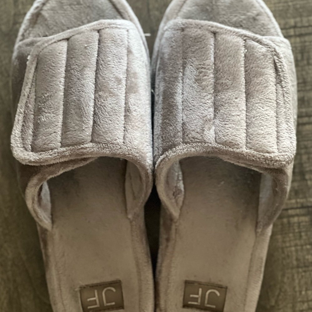 Worn grey slippers